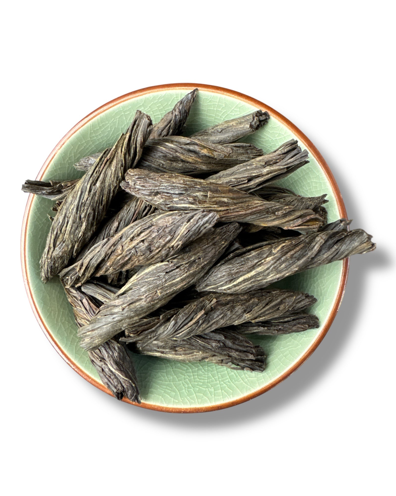 Eine Teeschale mit dem leuchtend beige-goldenen Aufguss des Ceylon Indulgashinna Blue Nettle