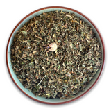 Teeschale mit dem Rohprodukt Kräutertee Ayurveda Kapha Bio