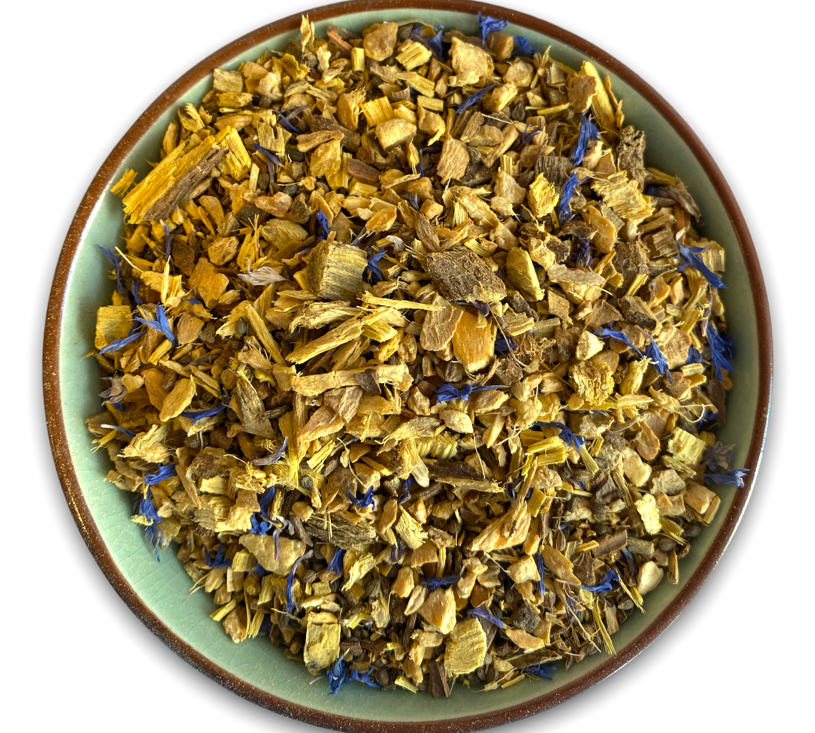 Teeschale mit dem Rohprukt des Kräutertees Ayurveda Vata bestehend aus Ingwerstückchen, Süssholzwurzel, Zimt und Kornblumenblüten