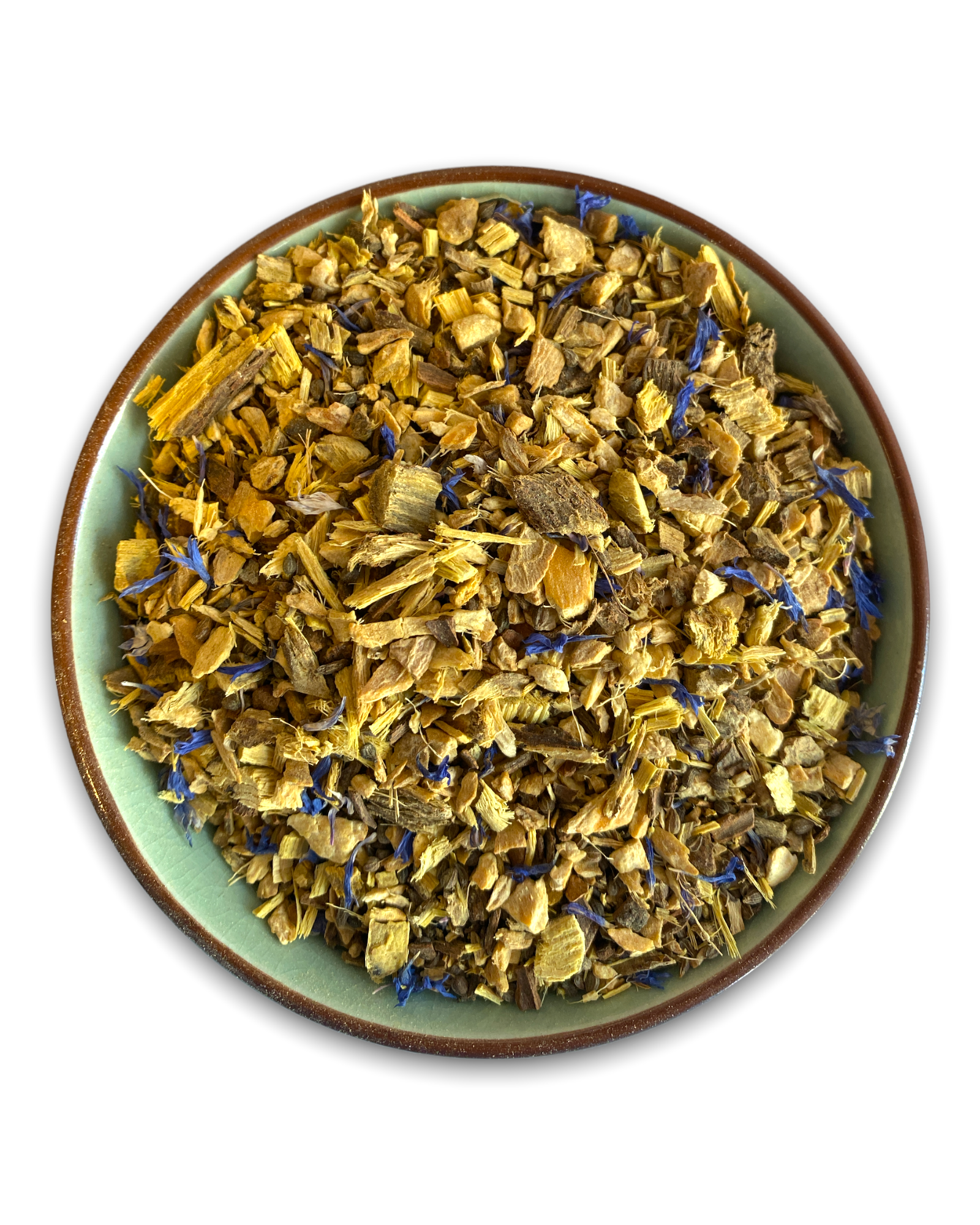 Teeschale mit dem Rohprukt des Kräutertees Ayurveda Vata bestehend aus Ingwerstückchen, Süssholzwurzel, Zimt und Kornblumenblüten